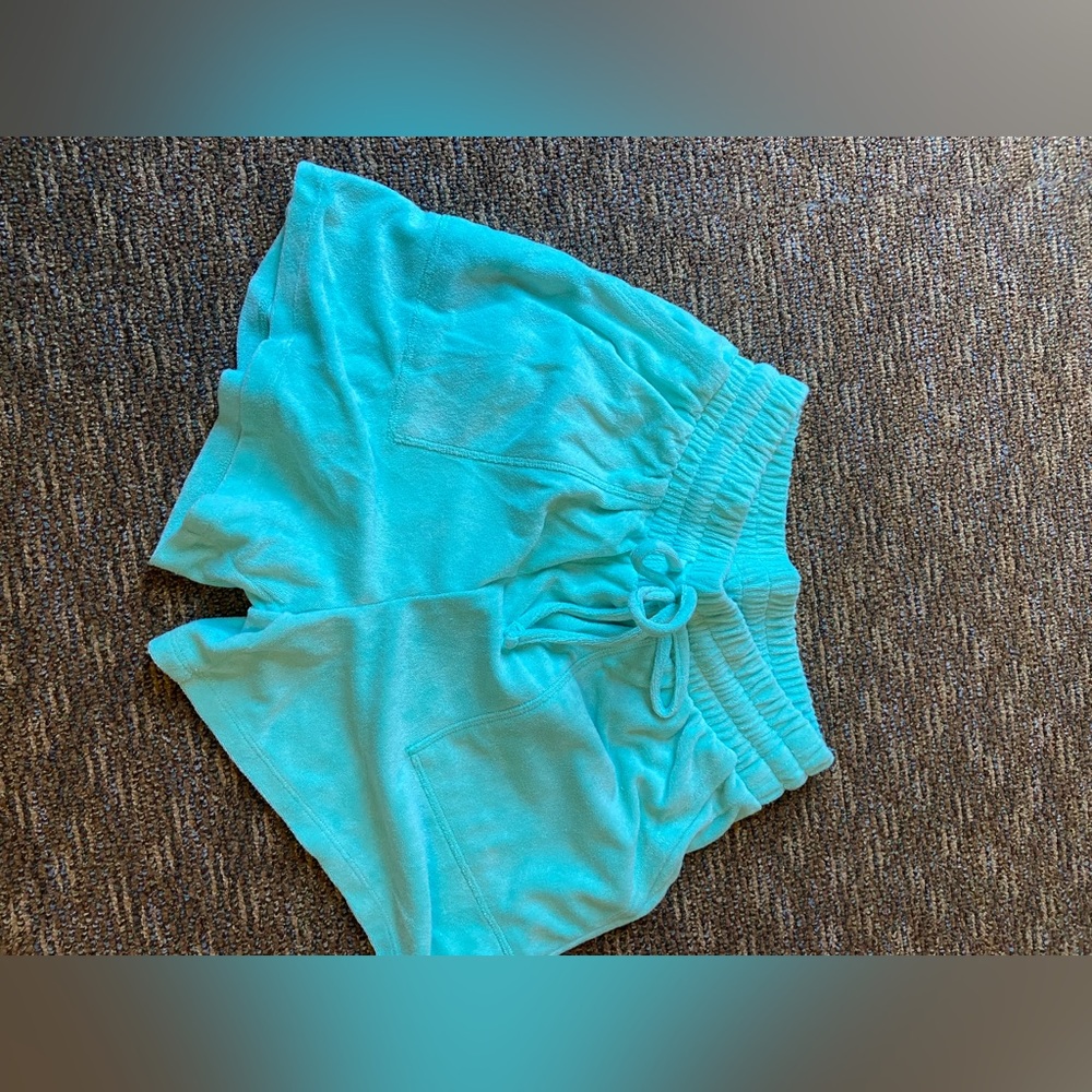 Super soft fun material shorts! Pretty teal color and are a modest fit!